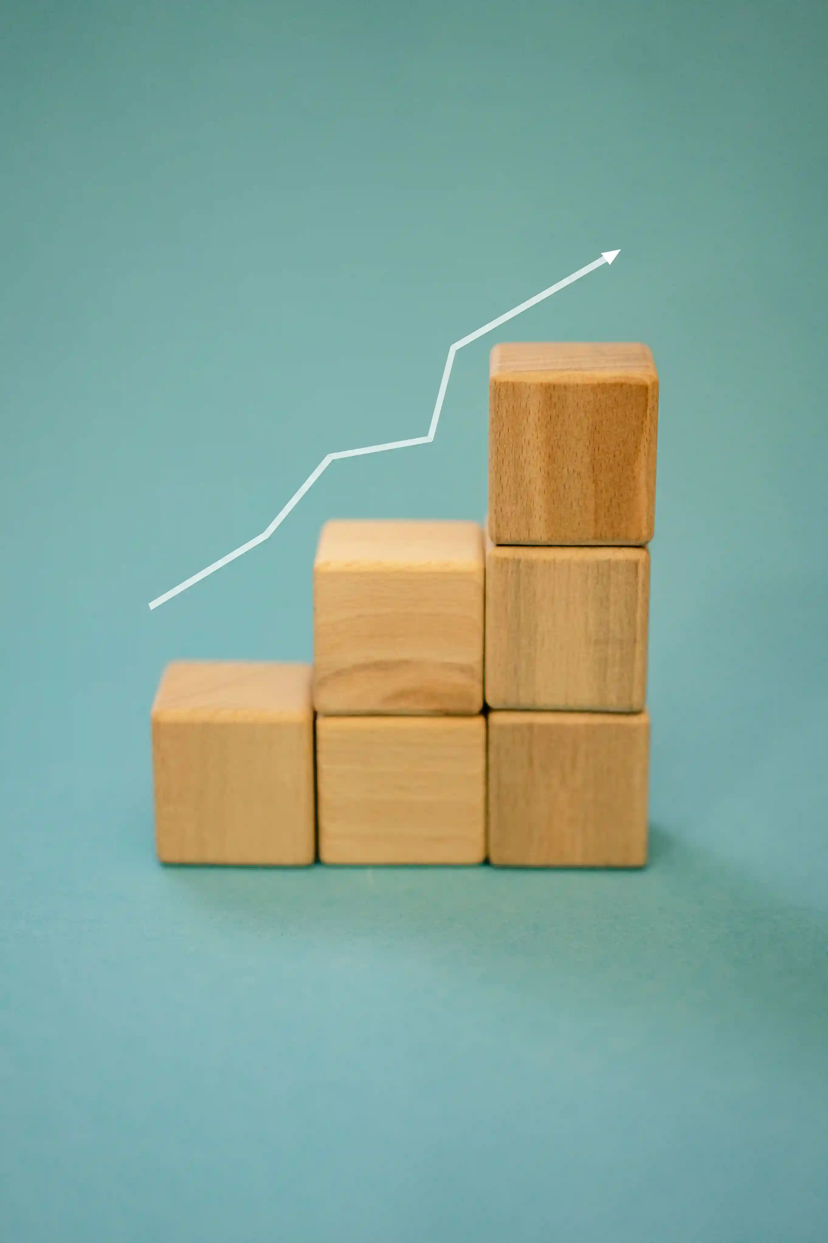 Ascending wooden blocks representing career development and professional growth