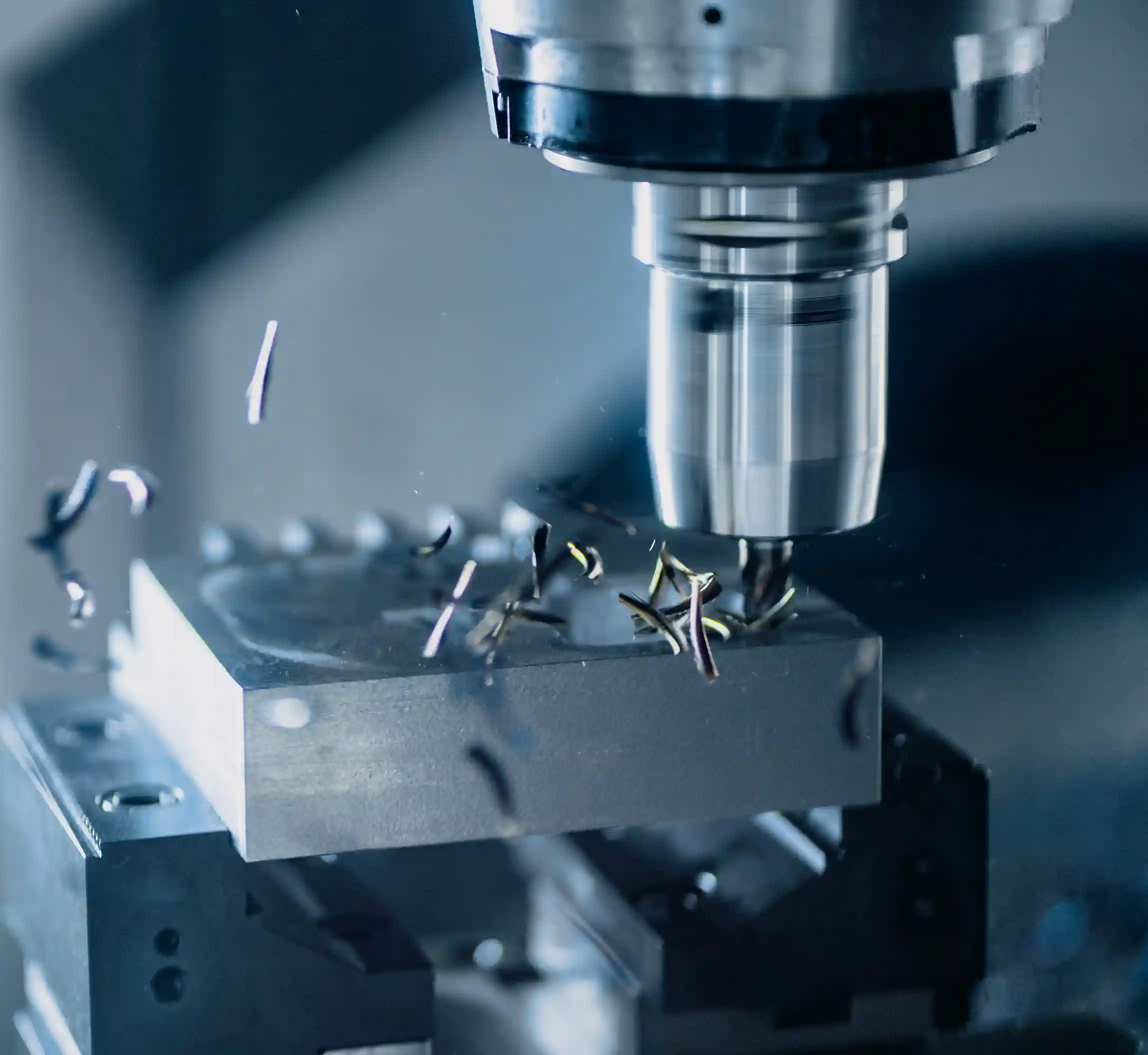 CNC machine cutting a precision metal component